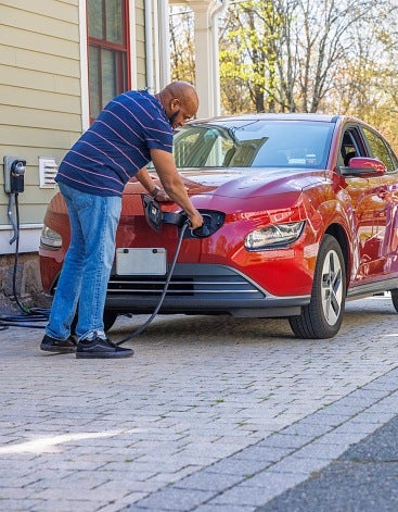 A Man Charging an Electric Car in the Backyard in San Jose, CA