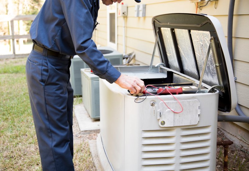 Generator Installation and maintenance by a technician outside the house in San Jose, CA